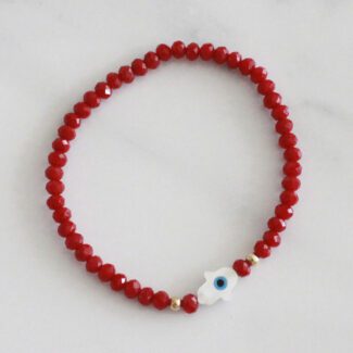 PULSERA CRISTALES ROJOS CON MANO Y OJITO EN CONCHA Y PERLA
